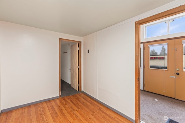 empty room with hardwood / wood-style floors