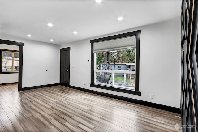 spare room featuring light hardwood / wood-style floors