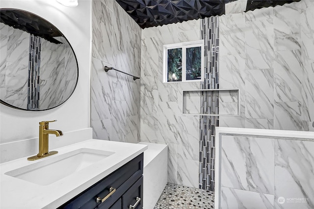 bathroom featuring vanity and a tile shower