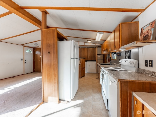 kitchen with vaulted ceiling with beams, washer / dryer, sink, light colored carpet, and white appliances