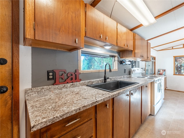 kitchen with white electric range, sink, and light stone counters