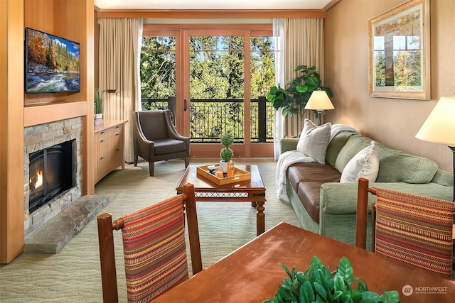 carpeted living room featuring ornamental molding