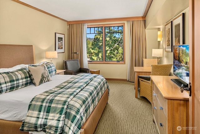 carpeted bedroom with ornamental molding