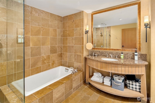 bathroom with vanity, independent shower and bath, and tile patterned flooring