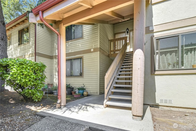 doorway to property with a patio