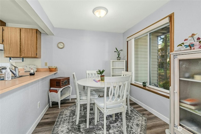 dining room with dark wood-type flooring