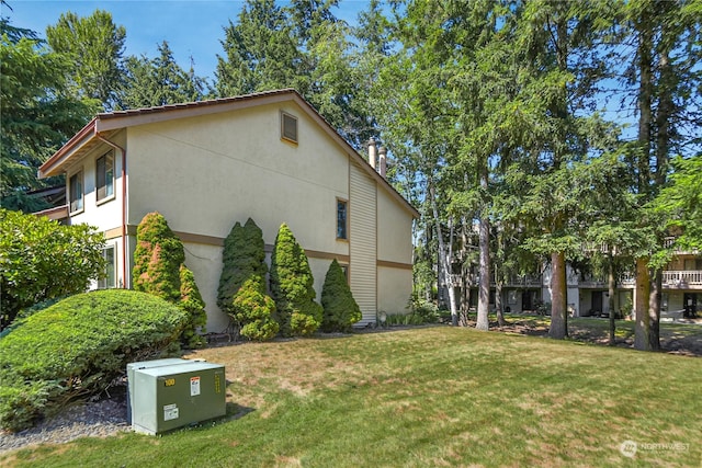 view of home's exterior with a lawn