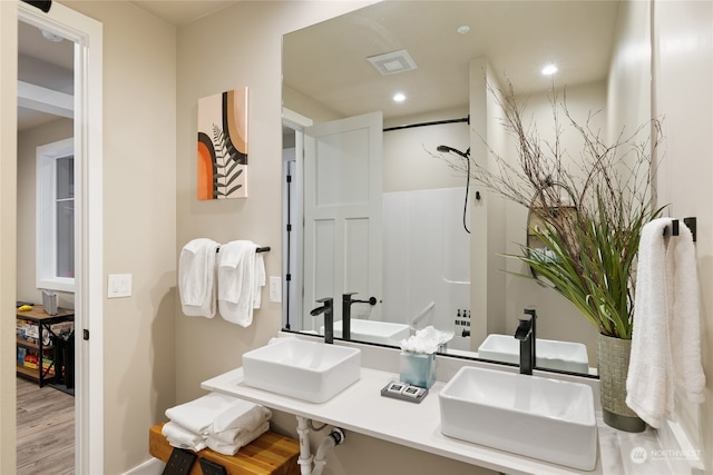 bathroom with vanity and hardwood / wood-style floors