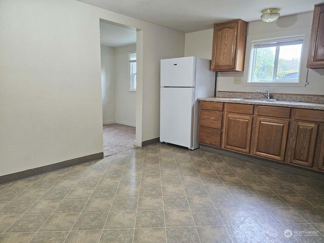 kitchen with white fridge and sink