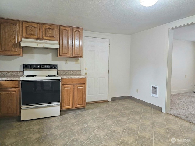 kitchen featuring electric stove, a textured ceiling, and heating unit