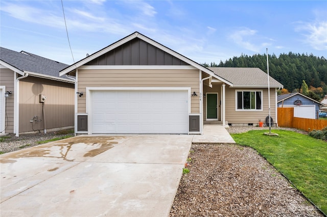 ranch-style home featuring a front yard and a garage