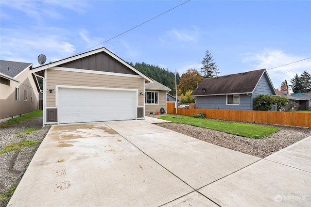 view of front facade with a front yard and a garage