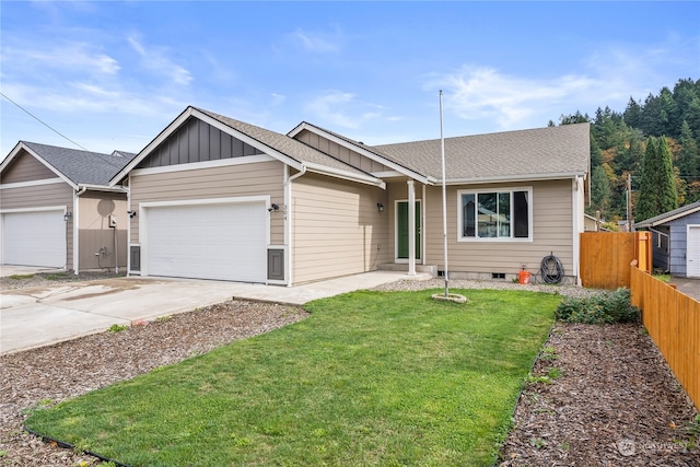 ranch-style home featuring a garage and a front lawn