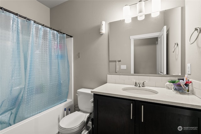 full bathroom with vanity, toilet, and shower / tub combo