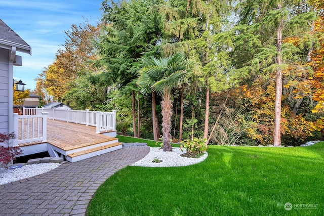 view of yard with a wooden deck