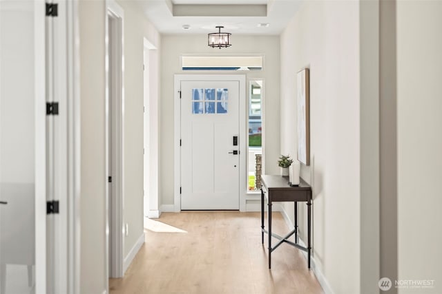 6361LOT257 Great Glen Rd SW, Port Orchard, WA 98367 - entryway featuring baseboards, a raised ceiling, and light wood-style flooring