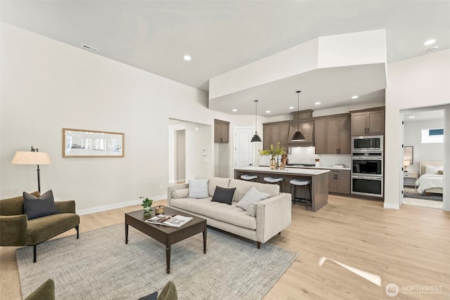 6361LOT257 Great Glen Rd SW, Port Orchard, WA 98367 - living room featuring recessed lighting, baseboards, visible vents, and light wood-style flooring