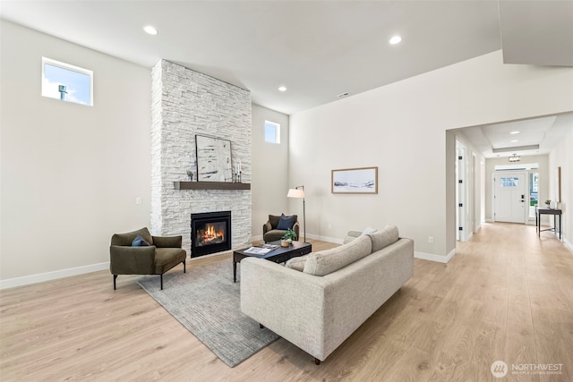 6361LOT257 Great Glen Rd SW, Port Orchard, WA 98367 - living room featuring recessed lighting, baseboards, a stone fireplace, and light wood-type flooring