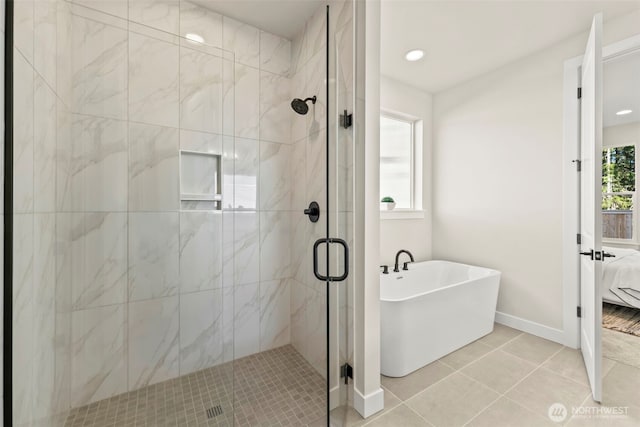 6361LOT257 Great Glen Rd SW, Port Orchard, WA 98367 - bathroom featuring a shower stall, ensuite bathroom, baseboards, and a freestanding tub