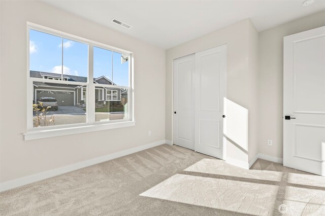 6361LOT257 Great Glen Rd SW, Port Orchard, WA 98367 - unfurnished bedroom with carpet floors, baseboards, visible vents, and a closet