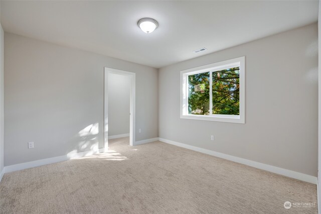 view of carpeted spare room