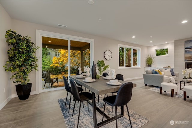 dining space with light hardwood / wood-style flooring