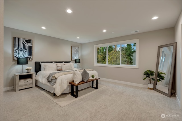 bedroom featuring light carpet