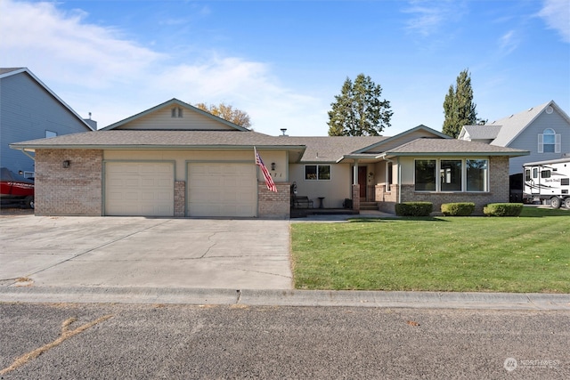 ranch-style home featuring a garage and a front yard