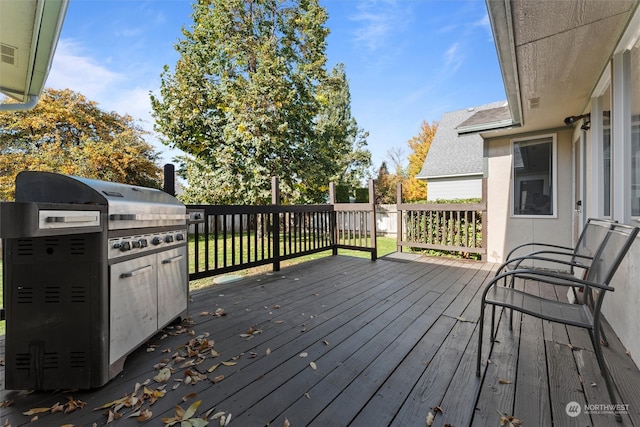 wooden terrace with a grill