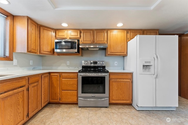 kitchen featuring light tile patterned flooring and appliances with stainless steel finishes