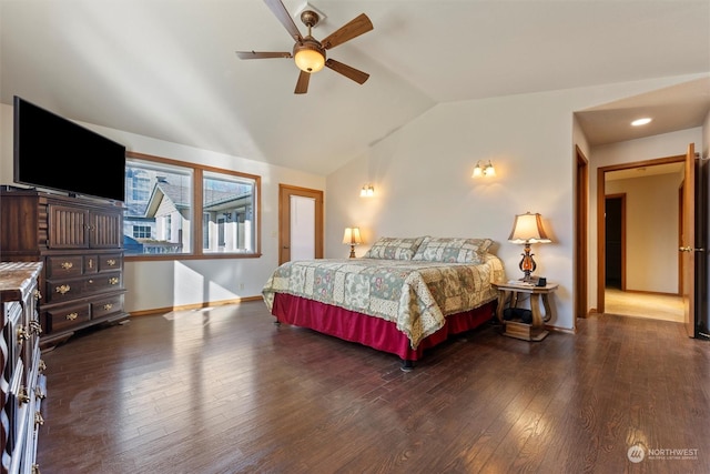 bedroom featuring vaulted ceiling, dark wood-type flooring, and ceiling fan