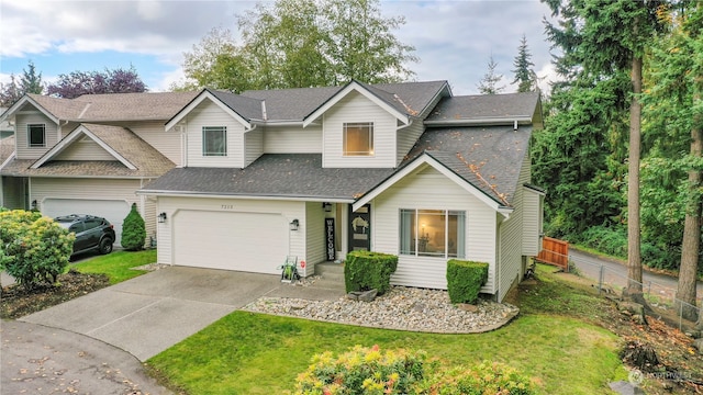 view of front of house with a garage and a front lawn