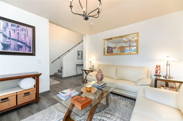 living room featuring dark wood-type flooring and a chandelier