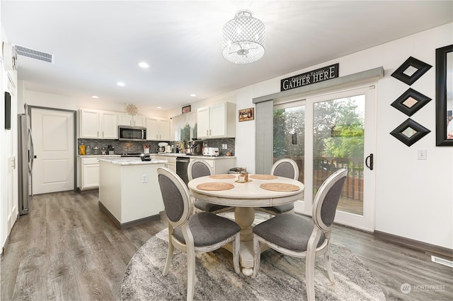 dining area with wood-type flooring