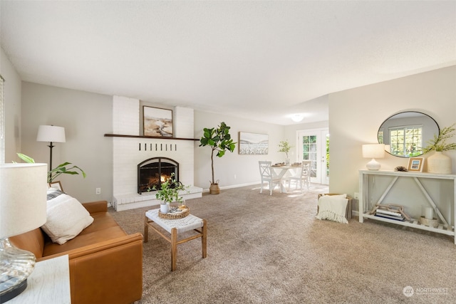 living room featuring carpet and a fireplace