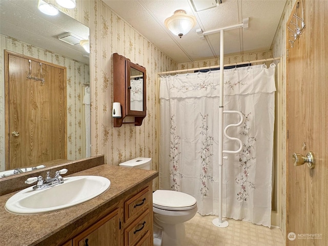121 Fircrest Dr, Sequim, WA 98382 - full bath with curtained shower, wallpapered walls, tile patterned floors, toilet, and vanity