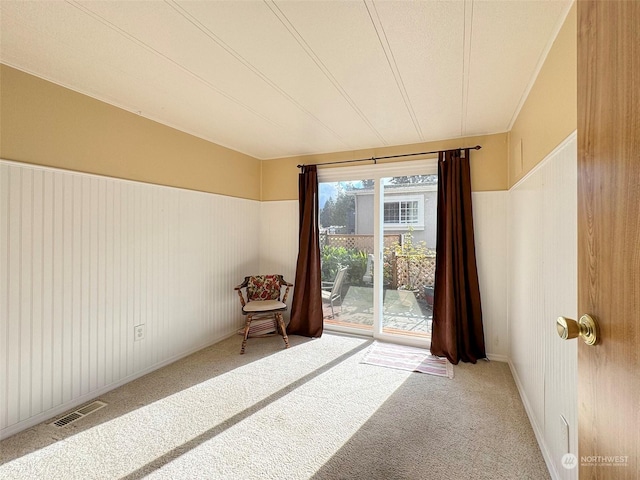 121 Fircrest Dr, Sequim, WA 98382 - unfurnished room featuring a wainscoted wall, carpet flooring, and visible vents