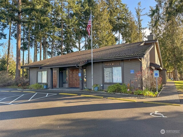 121 Fircrest Dr, Sequim, WA 98382 - ranch-style home with a tile roof, uncovered parking, and a chimney