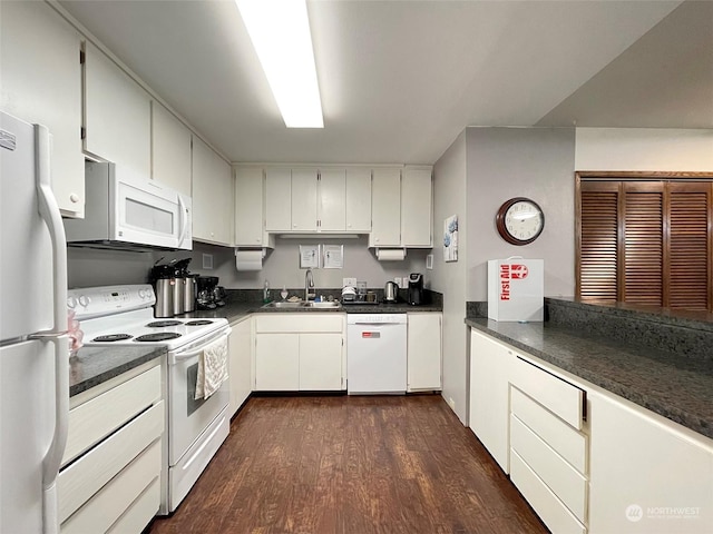 121 Fircrest Dr, Sequim, WA 98382 - kitchen featuring white cabinets, dark wood finished floors, dark countertops, a sink, and white appliances