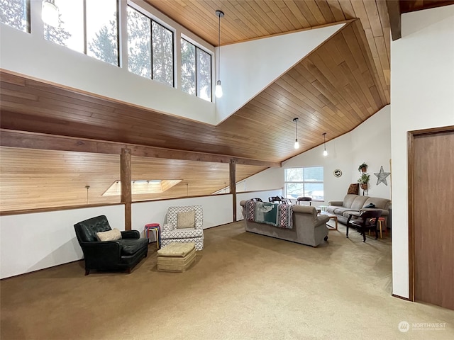 living area featuring wood ceiling, a high ceiling, and carpet floors