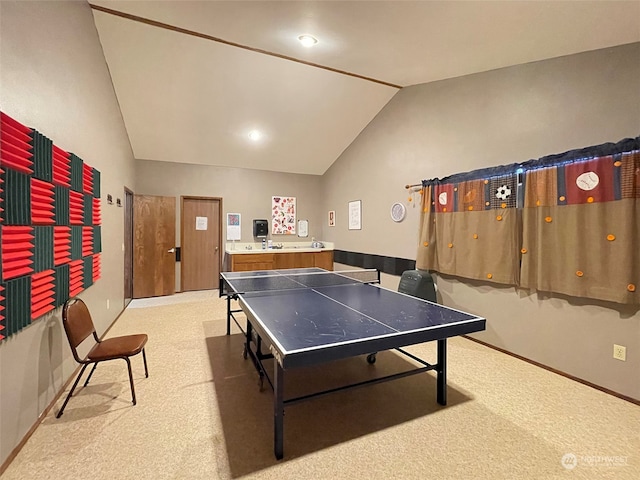 game room featuring lofted ceiling and light colored carpet