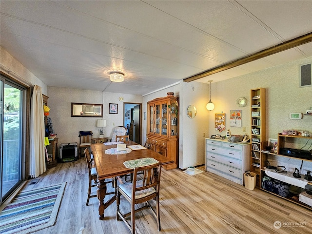 dining space featuring light wood-type flooring