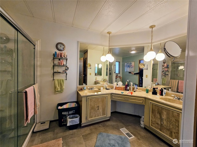 bathroom with vanity and an enclosed shower