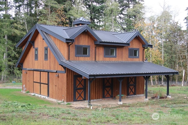 exterior space with a front yard and an outbuilding