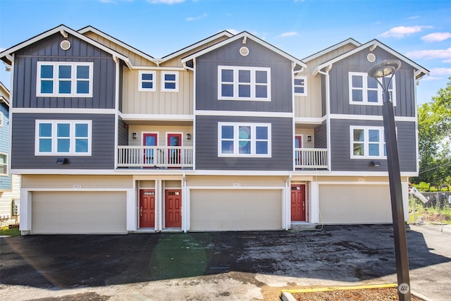 view of front of home with a balcony and a garage