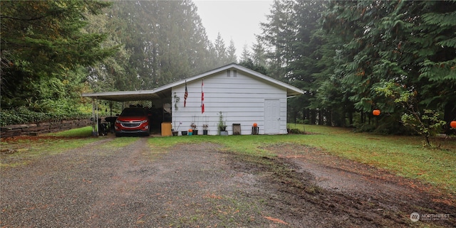 view of side of home with a carport