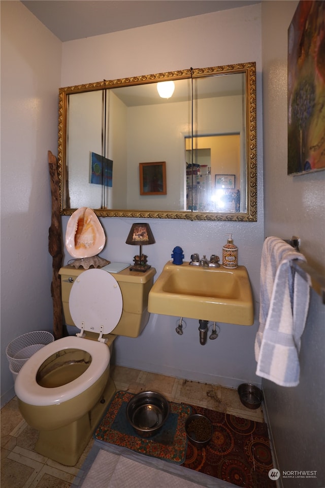 bathroom featuring sink and toilet