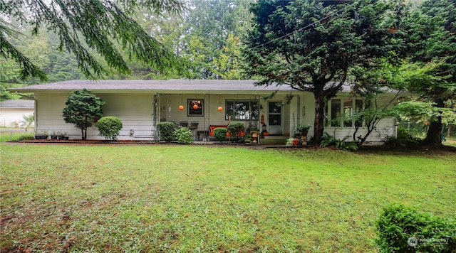 single story home with a front lawn and a porch