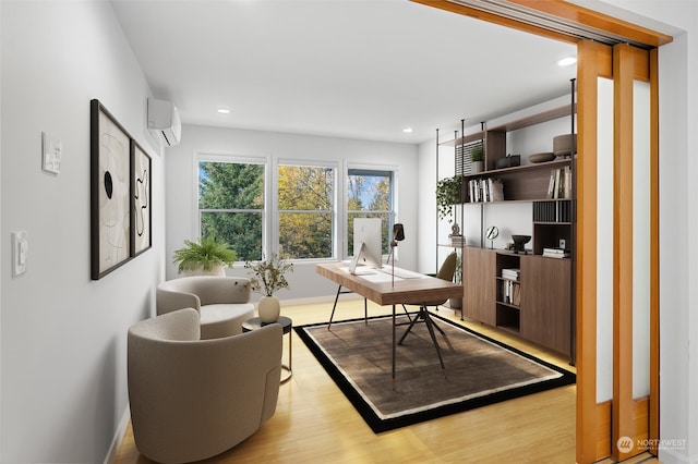 interior space with an AC wall unit and light wood-type flooring