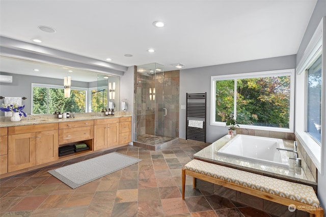 bathroom featuring a wall mounted air conditioner, vanity, and separate shower and tub